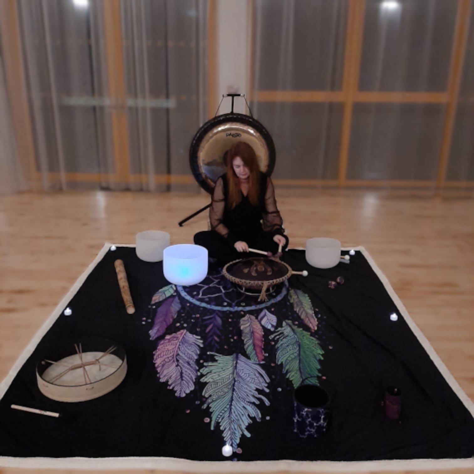 Carolyn playing crystal bowls
